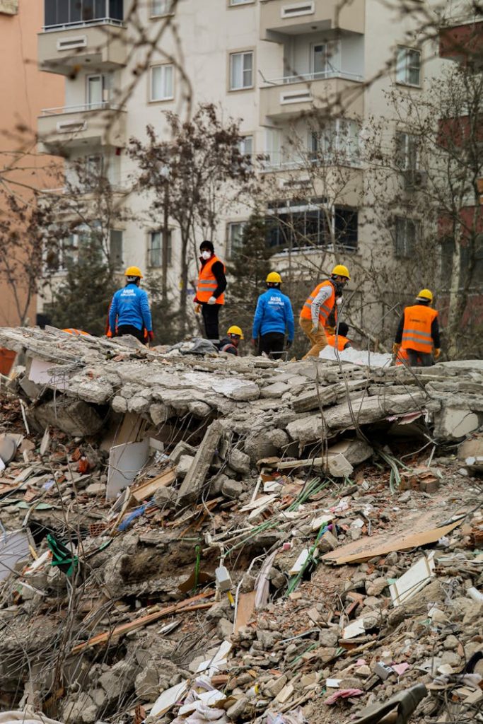 Rescue team conducting search operations on collapsed buildings after earthquake.